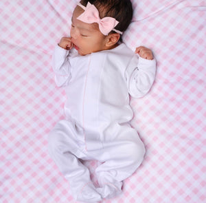 Baby girl with and pink footies